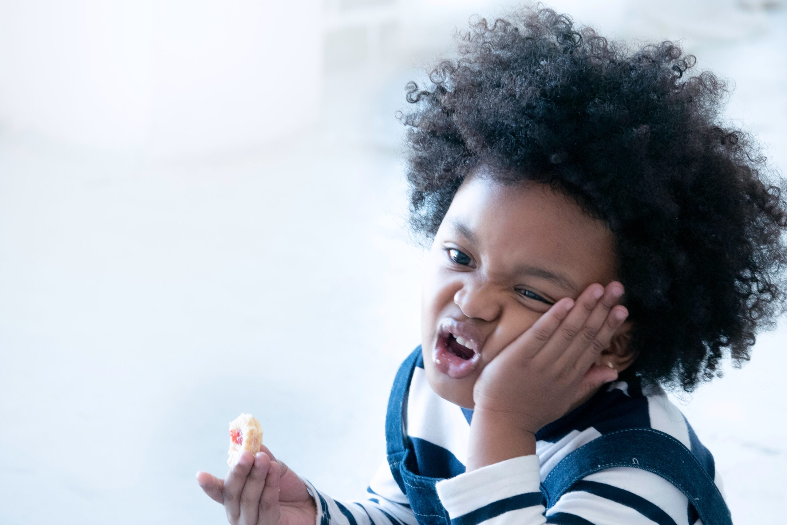 Why Your Child Holds Food in Their Mouth